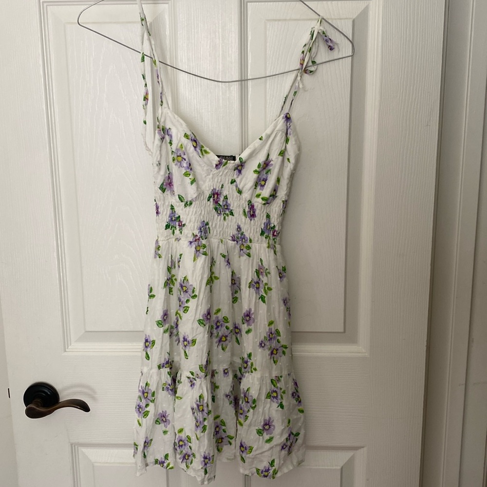 Short, floral, summer dress with adjustable straps and lining. Size XS